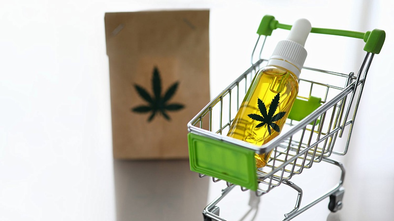shopping cart with CBD oil and a paper bag
