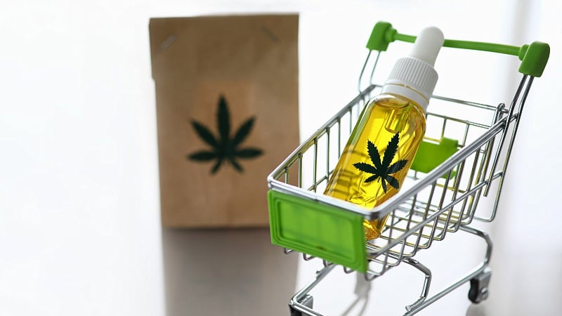 shopping cart with CBD oil and a paper bag